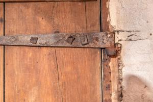 Reused strap hinge with eye forged on front and with leather was