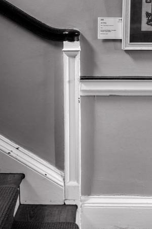 Reflected newel post at base of stairs, 180005