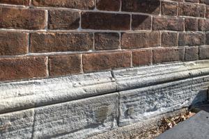 Stone plinth and water table on principal facade; 1800-05