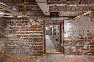 Cellar partition added soon after construction; ruled joints