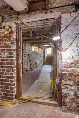Early door frame in cellar with original Spanish brown paint