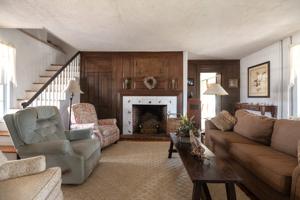 Antique bolection mantel and paneling moved into hall, ear;ly 20