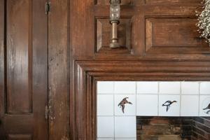 Antique bolection mantel and paneling moved into hall, ear;ly 20
