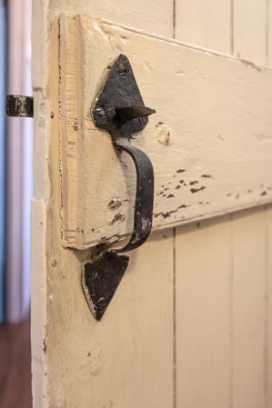 Thumb latch replacing lock on second-story closet door