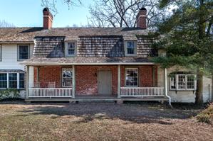 Front of house, 1792, with 19th-century wing to right and recent