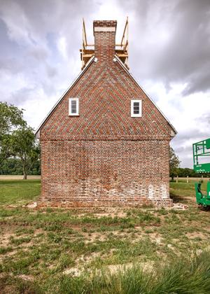 Glazed-header Flemish bond with chevron-patterned upper gable; 1