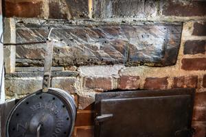Graffiti on kitchen fireplace lintel