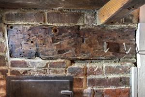 Graffiti on kitchen fireplace lintel