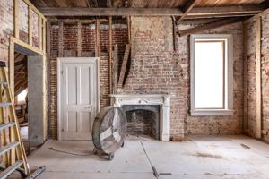 Roof literally raised to create taller 2nd story in 1880s