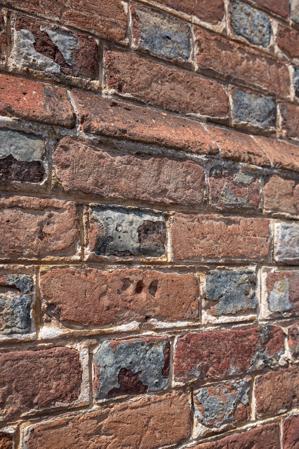 Bricks showing distress marks created when mold remove; fingerpr