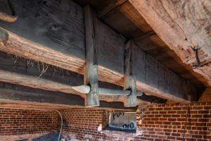 Hanging rod in ice house in cellar of outbuilding; 2nd quarter 1