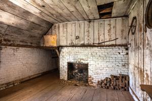 Fireplace in hospital; note missing shelf along fireplace wall; 