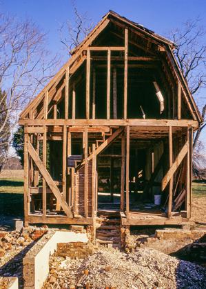 Strange roof form of a gambrel front and gabled rear; 1805