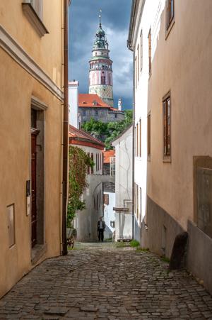 Castle viewed through alley in town