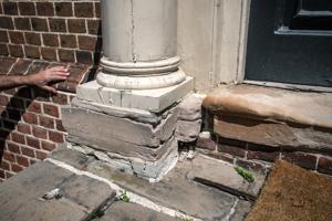 Plinth under frontispiece columns made of Aquia sandstone