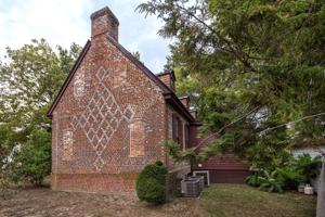 Gable decorated with glazed headers in a diaper pattern; 1750