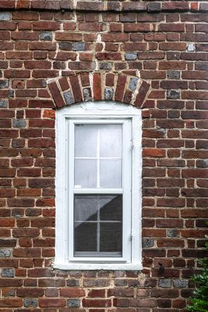 South gable window with segmental arch and alternating glazed he