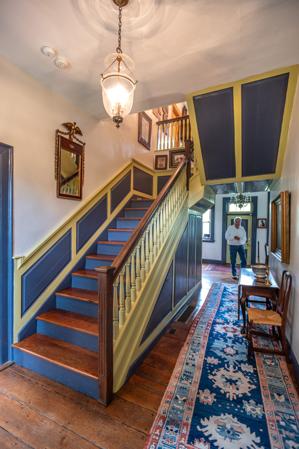 Stairs double loaded at top for independent access to front and 