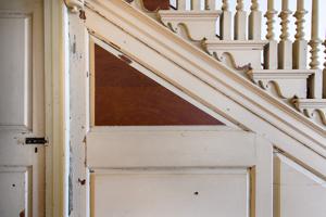 Ooriginal graining uncovered on stair paneling